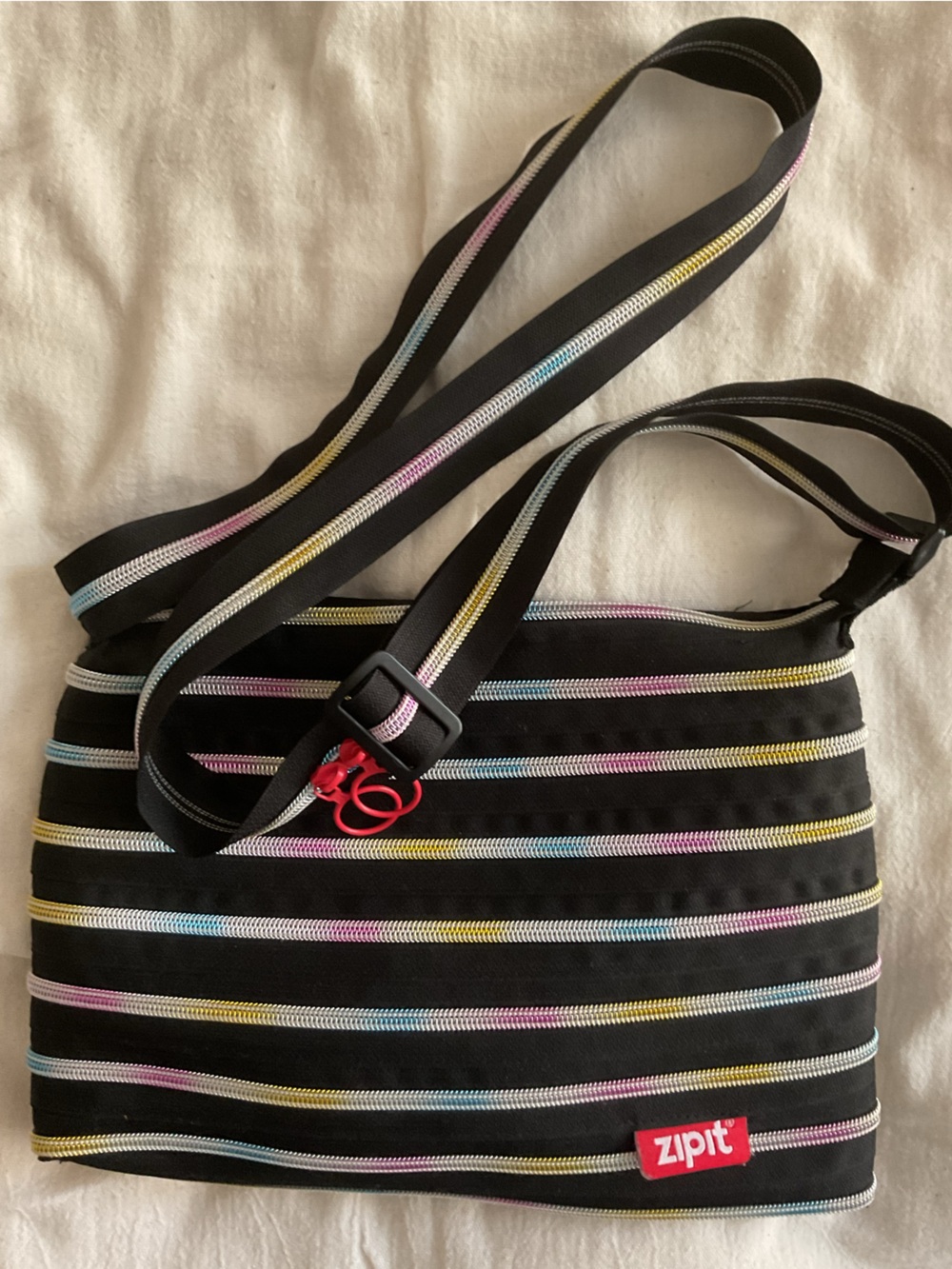 Zipit Women Black Crossbody Bag with Pastel Stripe Accents. NWOT condition. Os.